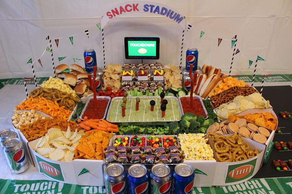 Delicious food for american football game party with remote